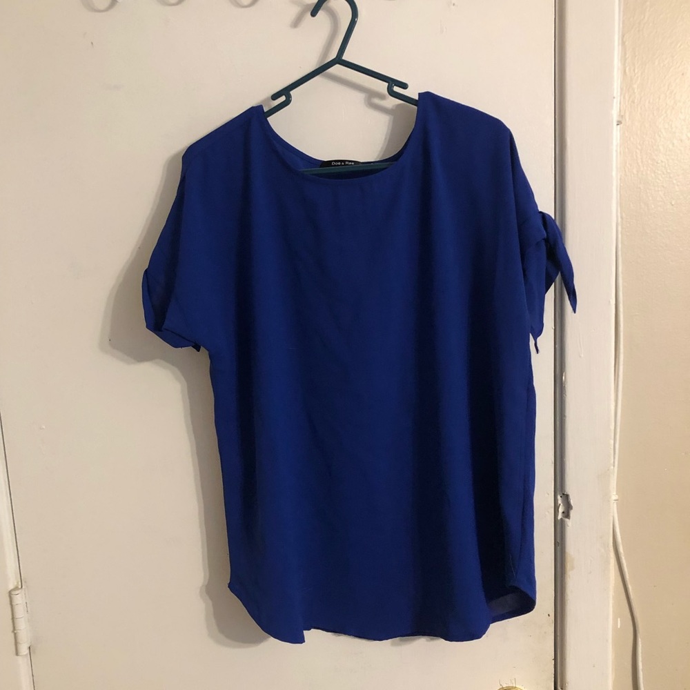 Doe & Rae brand, size M, royal blue blouse with tie on sleeves.